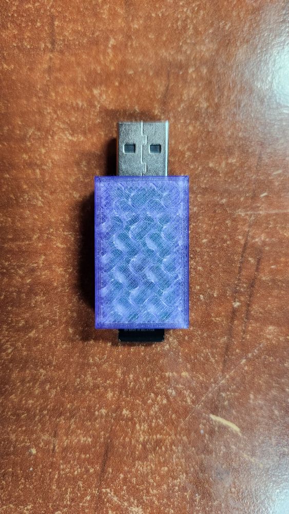 Top of the final USB to SD card adapter design. You can slightly see the green PCB through the housing.