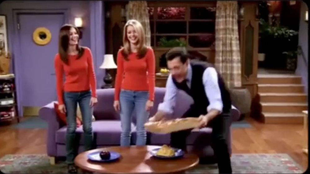 weird still of the guy putting hte pizza on the mashed potatoes (?)