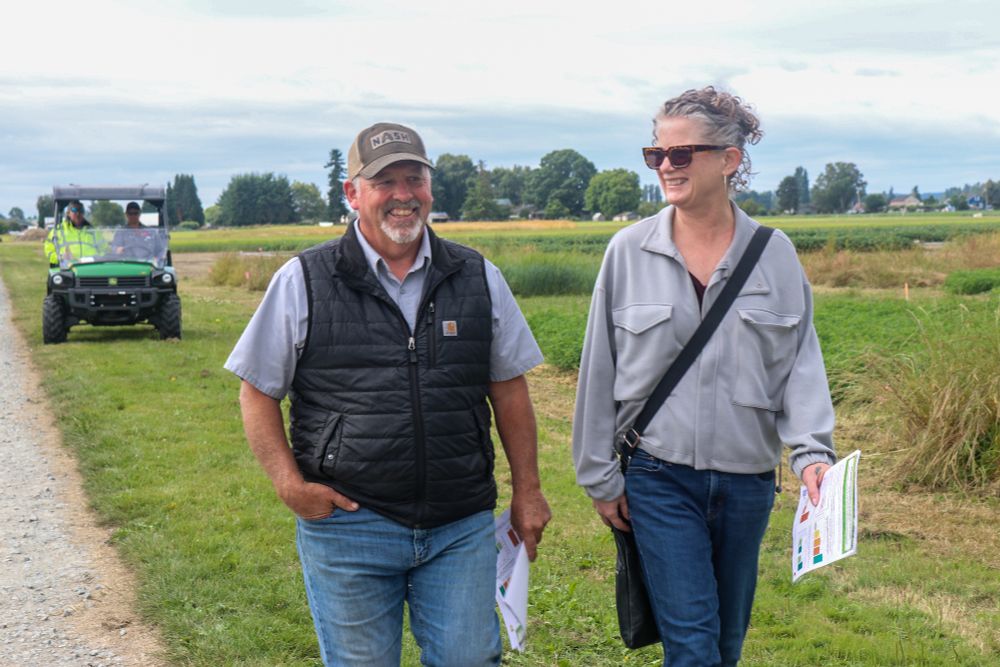 Darrin Morrison, Morrison Farms and Kim Matthews, Western Washington Agricultural Association chat while walking between presentations.