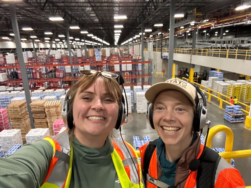 MSU's Cheyenne Sloan and CSANR's Teal Potter (Climate Analogs Academy coordinator) pose for a selfie at a Stemilt Growers packing plant.