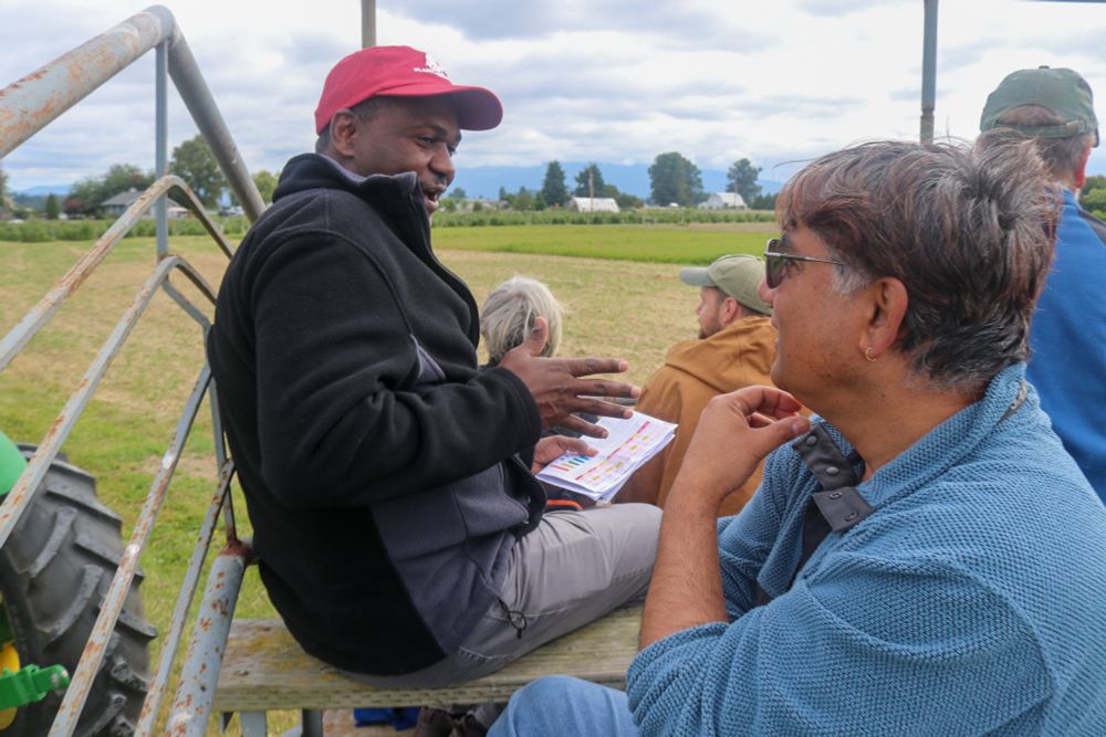 Sintayehu Daba, WSU Plant Pathology and Sanjaya Gyawali, Sakata Seed have a discussion while riding to the next presentation.
