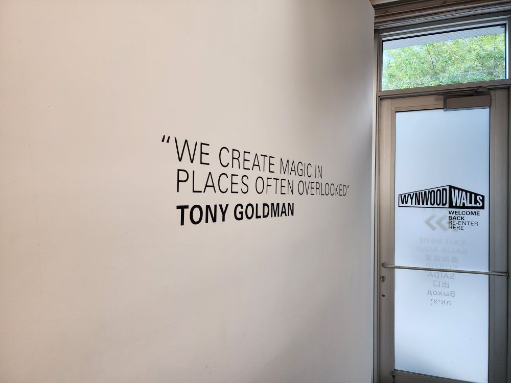 Wall with a printed quote: "we create magic in places often overlooked."
