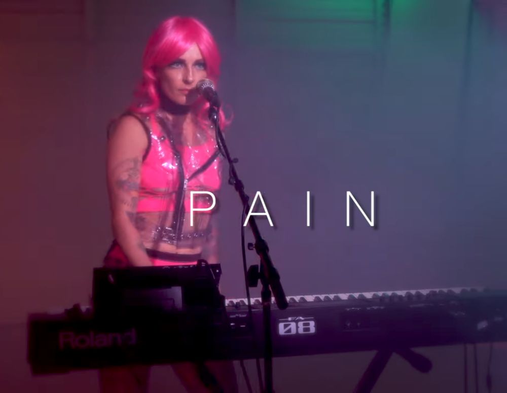 Screenshot, Le Destroy & The Red Glare  "Pain" live perfance music video (Kink In Pop Culture- music, 2023)


Cyberweek!
7 days where Techno-fetishists take center stage

https://youtu.be/SfDxpP2iGvU?si=_mvasF_mj2yJsVSx
Version featured on the CYBERPUNK 2077 SOUNDTRACK

https://youtu.be/Vloe5Ol26nY?si=-2AVRY7eNBzBnm7C
Live version

Lyrics… 

Continue reading-
https://www.tumblr.com/theakandrewscollection/803219801420054528/cyberpunk-2077-soundtrack-pain?source=share

#KinkInPopCulture #kink #bdsm #fetish #S&M #pain #CYBERPUNK 2077 #Le Destroy #LeDestroyPain #Soundtracks #Music #2023ce #2020s #TheRedGlare
