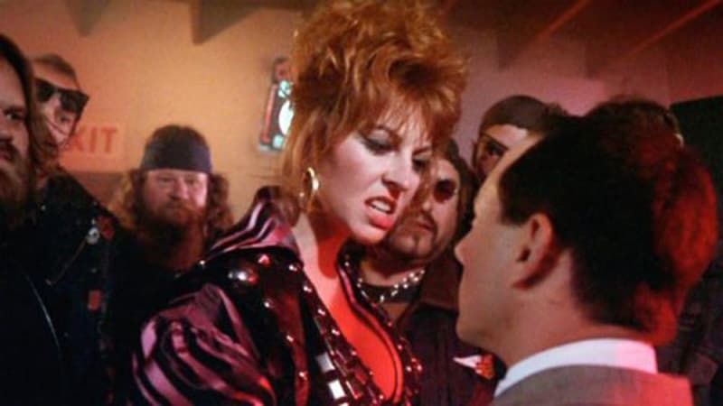 Screenshot, Cassandra Peterson  as "Big Mama" threatening  Paul Rubens as "Pee-Wee Herman" in Pee-Wee's Big Adventure (1985).