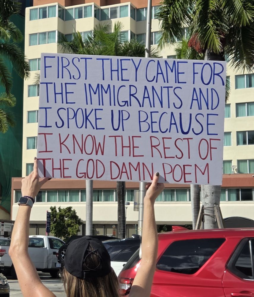 Sign saying first they came for the immigrants and I spoke up because I know the rest of the goddamn poem