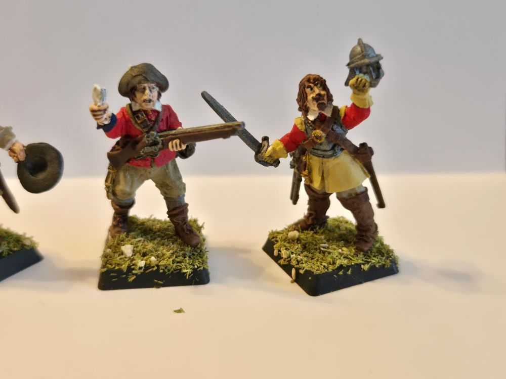 Two New Model Army guys from Bloody Miniatures, one wielding a sword and helmet and the other a musket and an Agreement of the People 