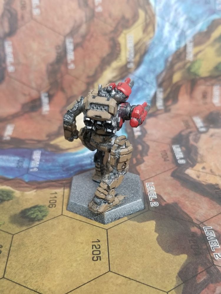 Rear view of a Starslayer from Battletech, in army brown with red on the torso mounted Laser and Laser arm