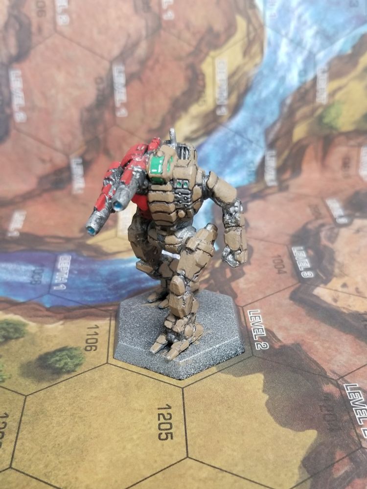 Front view of a Starslayer from Battletech, in army brown with red on the torso mounted Laser and Laser arm