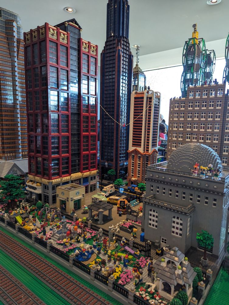 A huge Lego city with skyscrapers, with two railroad tracks running beside it. (Also Spider-Man, the Powerpuff Girls, and lots of other fun little Easter eggs are built into the scenery.)