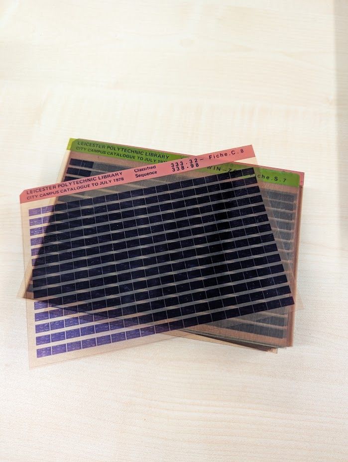 Colour photo of a stack of microfiche