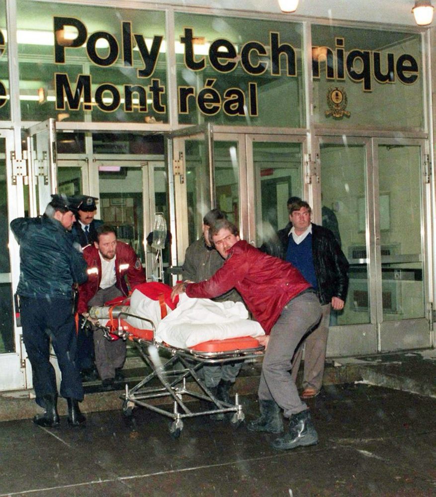 Victim on a stretcher is wheeled out of the École Polytechnique in Montréal, Dec 6, 1989.