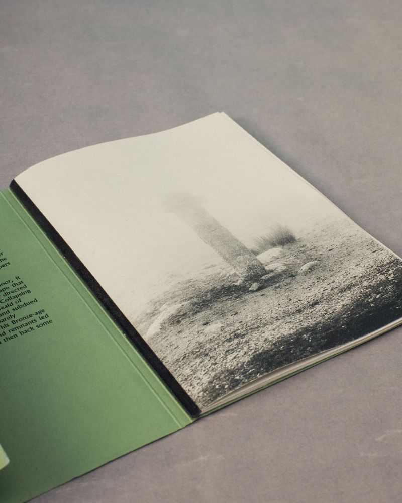 Dumnonia photobook by Joe Charrington, published by Hastings based bookmakers Bracken Books. The cover opens is open and the first photograph is Siward's Cross within the mist of Dartmoor.