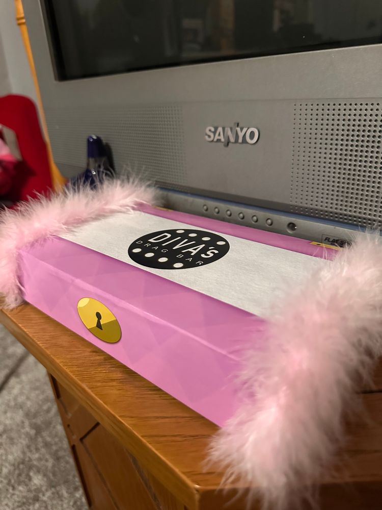Demo game box with pink boa edges and lockbox design