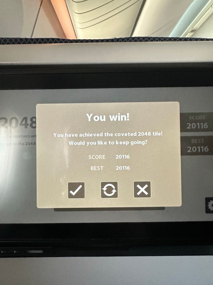 A photo of my high score playing 2048 on a plane. It was 20116.