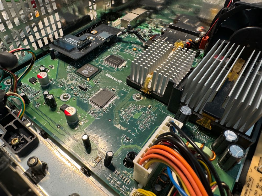 Overall shot of Xbox motherboard with Project Stellar modchip installed.