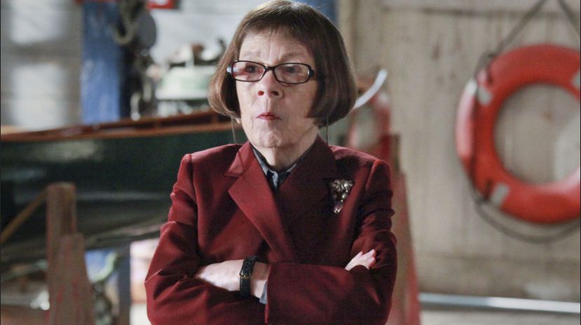 Hetty from NCIS looking disapproving with arms crossed 