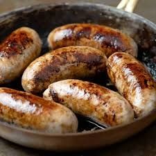A bunch of bangers in a pan