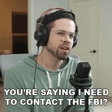 GIF of a white man sitting with headphones on saying "you're saying I need to contact the FBI?"