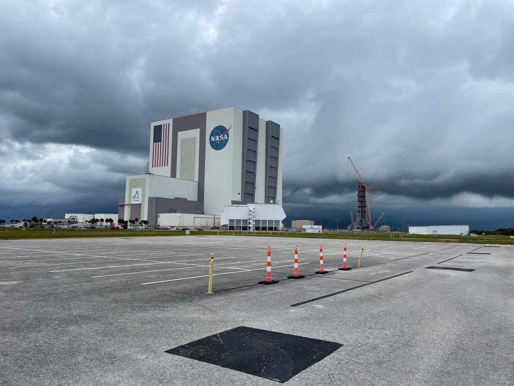 Kennedy Space Center VAB with dark clouds low in the sky to the north