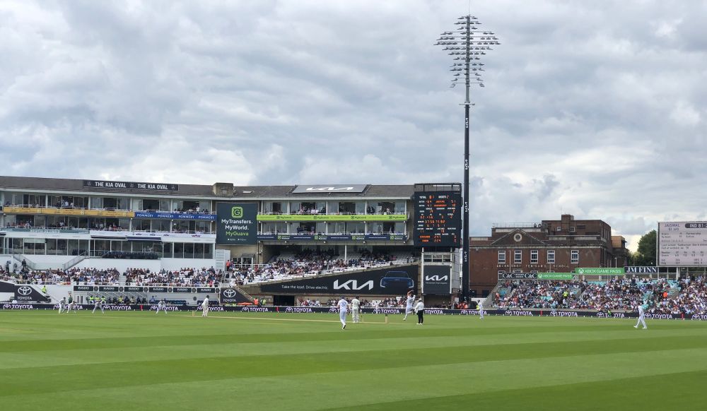 A photo of a cricket match from the stands. 
