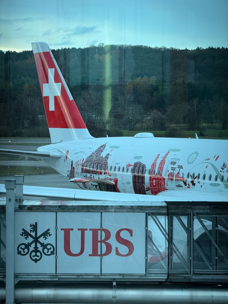 A view of Swiss’ ‘Wanderlust’ A350 out the terminal window.