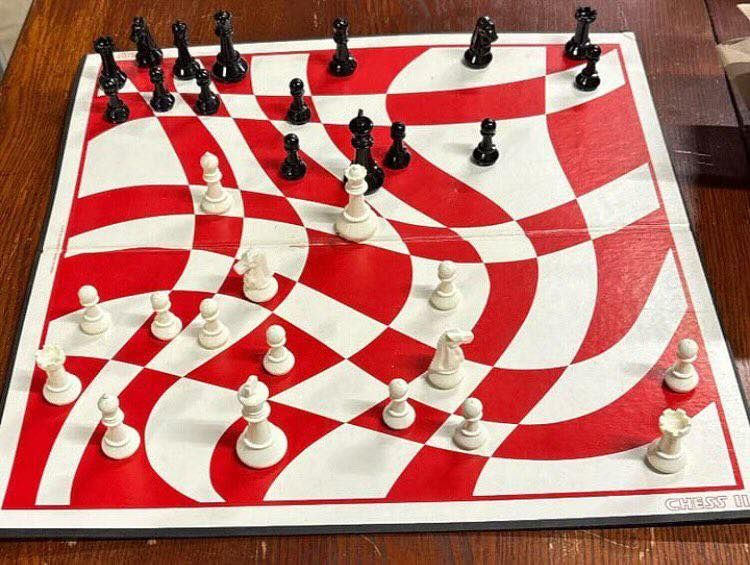 A red and white chessboard with pieces in play, but the regular 8x8 grid has been highly distorted into highly Irregular curvilinear quadrilaterals.