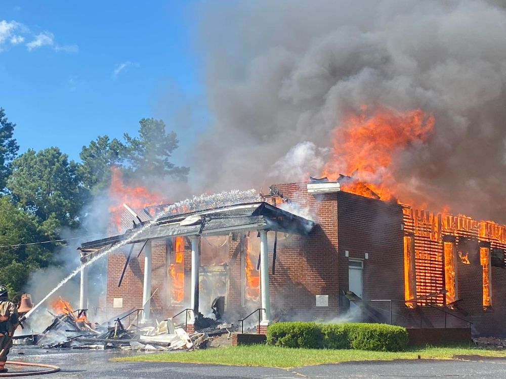 Photo of Pleasant Grove church on fire.