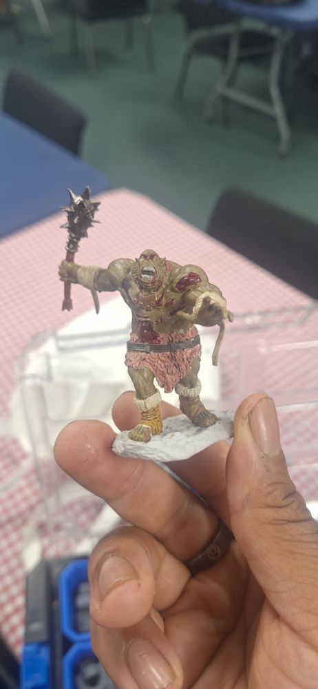 Ogre zombie with chunks of missing flesh on the gut and left shoulder 