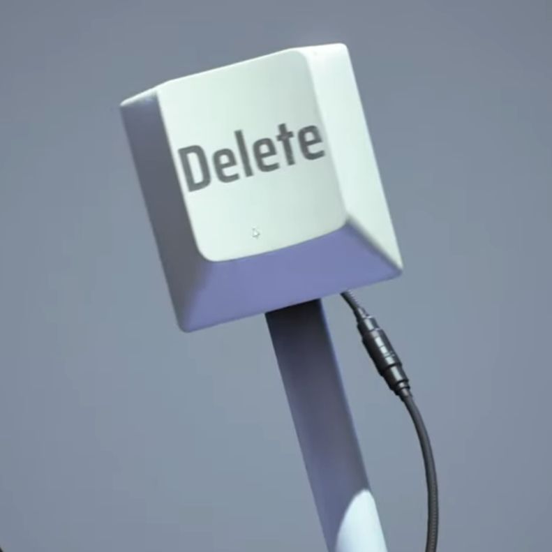 A giant delete key on a stick. The image is from the videogame "the FINALS"
