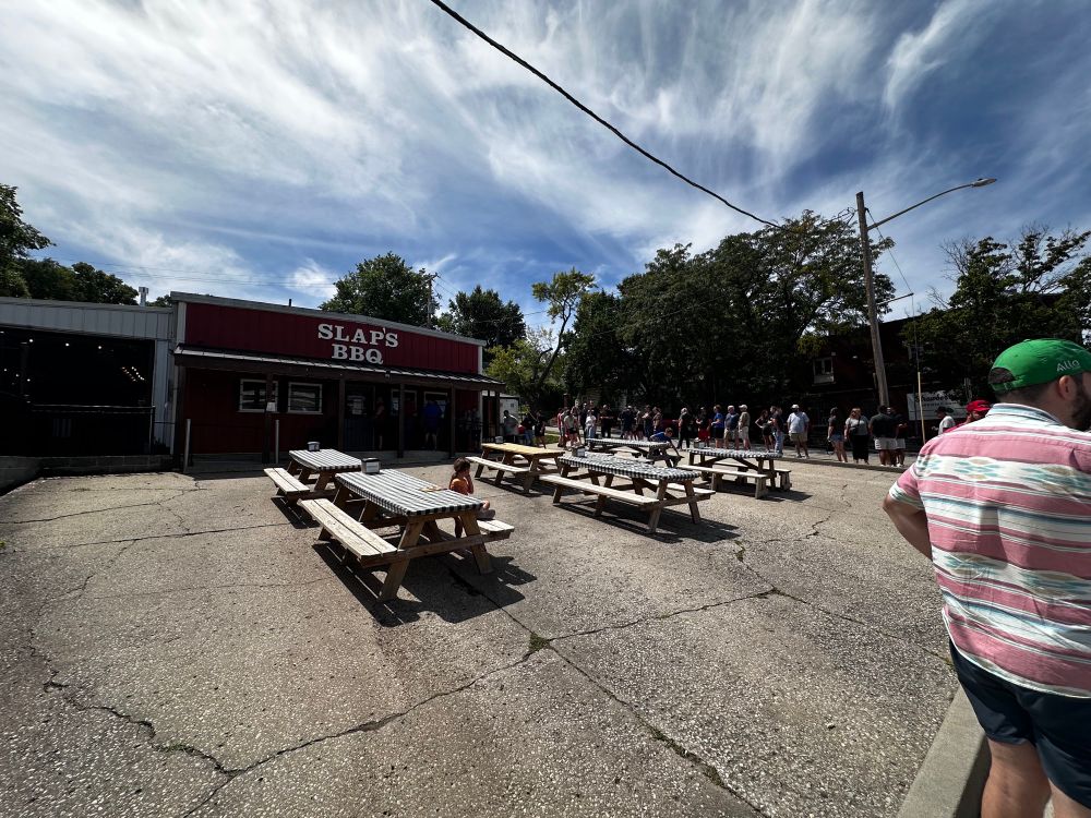 Line of people around the corner, waiting to buy bbq from Slap’s in Kansas City, KS.