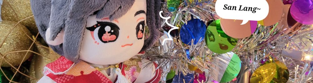 Minidoll Hua Cheng noticing Xie Lian's face reflected in the christmas tree. 