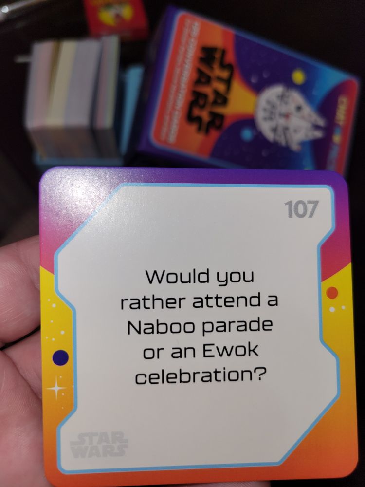 A conversation card from the Star Wars chat pack, the question says would you rather attend a Naboo parade or an ewok celebration?