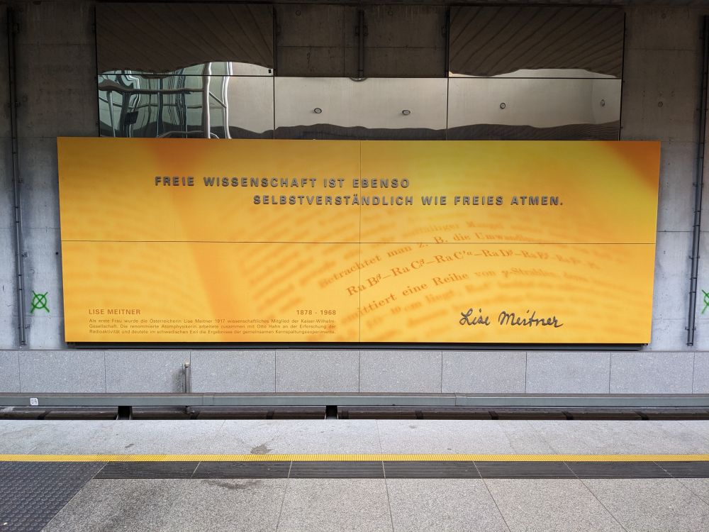 Sign in the Munich subway showing the quote from Lise Meitner given in the post.