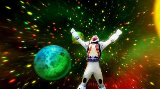 A boy in space-themed armor shouting in joy as stars and planets swirl around him.