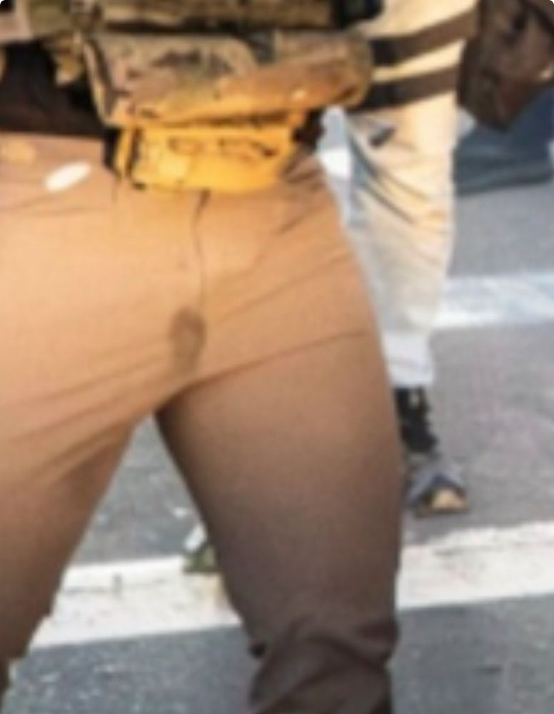 The riot gun man has a little spot on his little pants.
