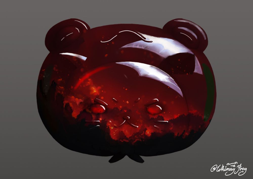 resin and wood shaped as a cat wearing a frog hat