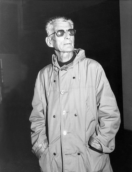 Samuel Beckett in a quality coat and sunglasses. 