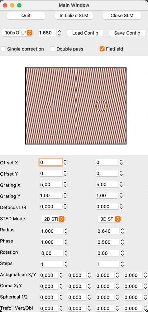 GUI with many numeric controls. In the middle, the phase pattern on the SLM is shown. The pattern is split in the middle. Both halves show a diagonal grid. The left half has a point-singularity in the center, the right half a circle.