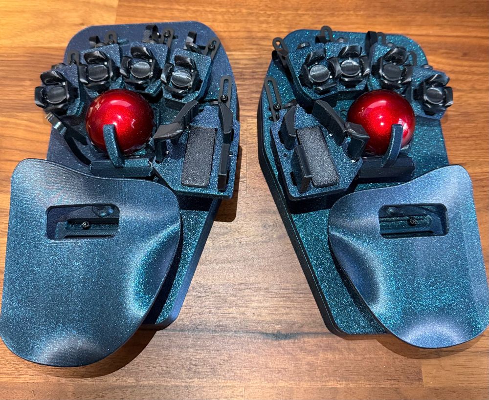 Svalboard keyboard kit printed in galaxy blue with black keys & red trackballs