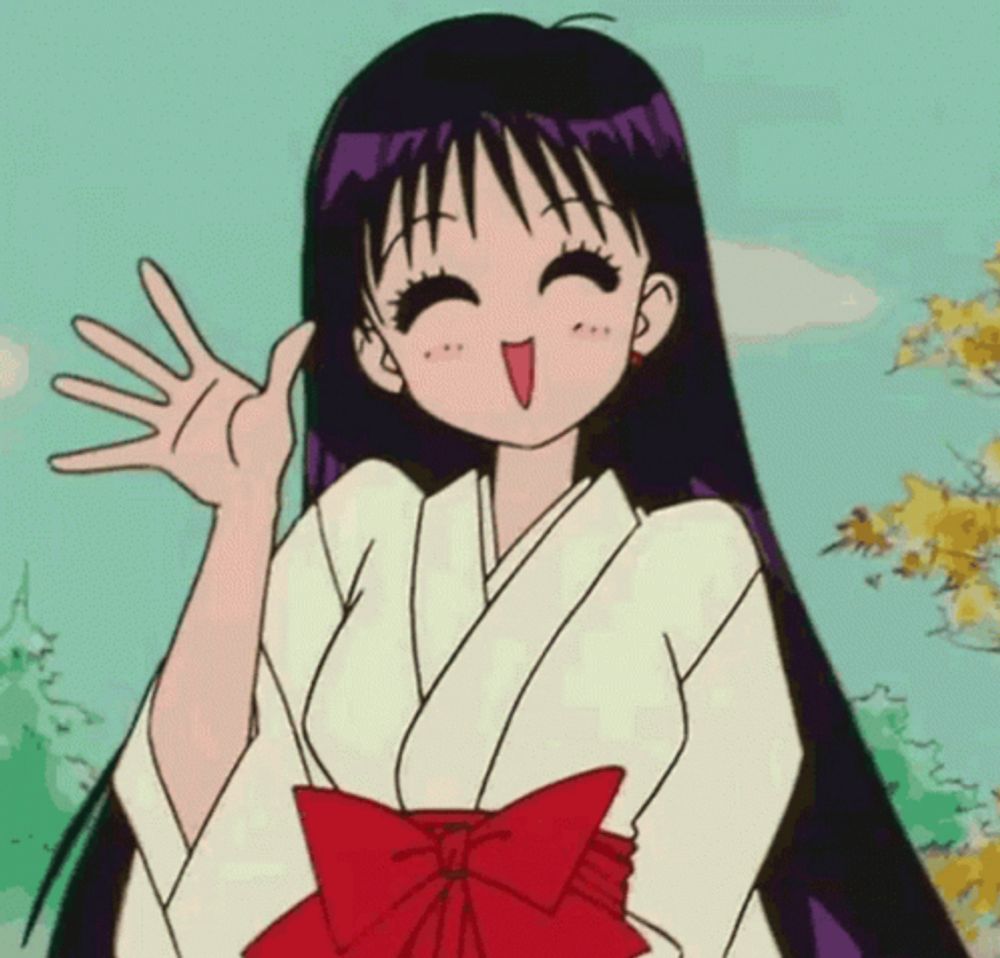 a girl in a white kimono with a red bow on her skirt is waving her hand .