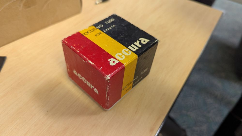 Accura focus tube for exakta box. Bright yellow, red, and dark black stripes and colour blocking.