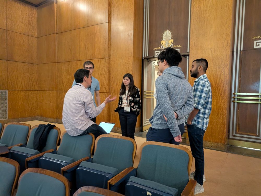Group of six C-CAS members together in discussion