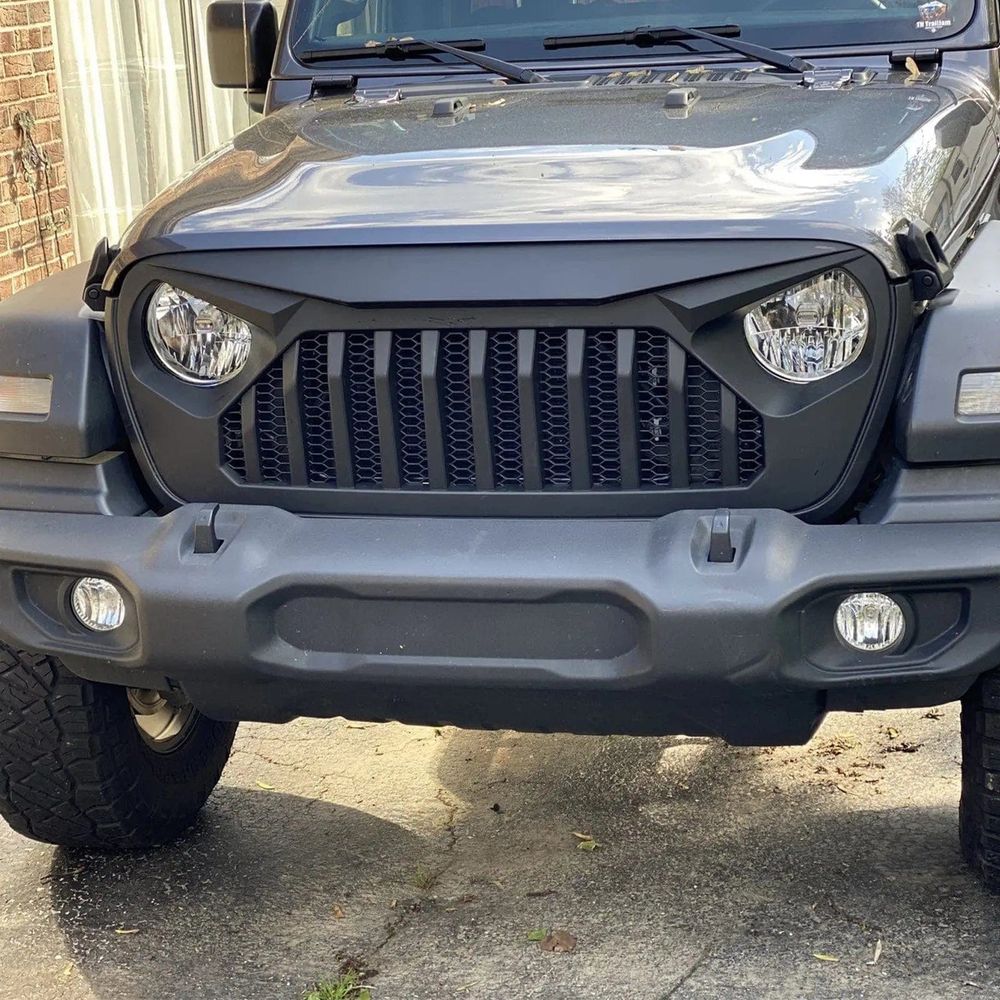 A Jeep with a grille that makes the headlights look like angry eyes
