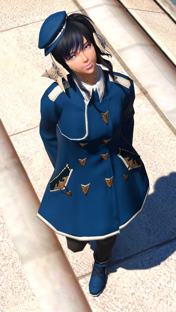 An au ra from FFXIV with dark hair and a blue coat standing and smiling up at the camera