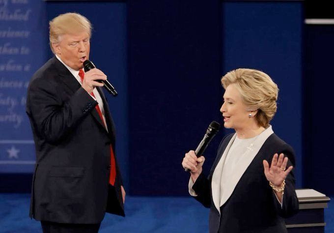 Hillary Clinton and Trump both wandering onstage during debate with hand-held microphones