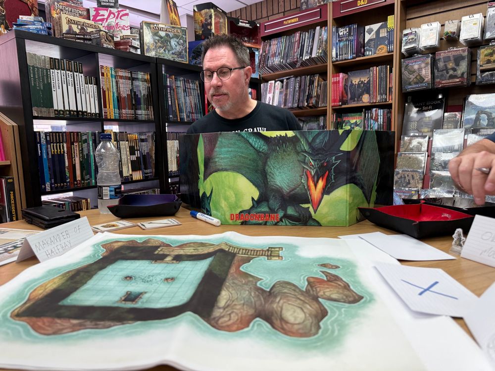 GM behind a GM Screen for DragonBane