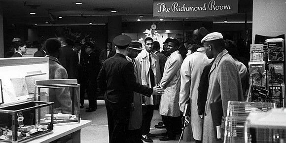 Virginia Union University students sitting at the whites-only lunch counter of Richmond's Thalheimers Department Store.

