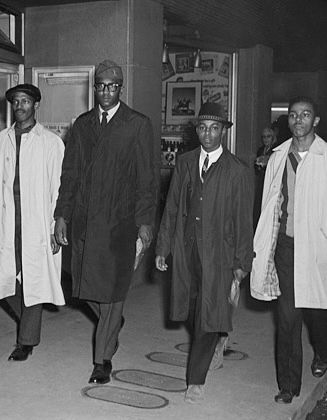 Black and white photo of the Greensboro Four. 
