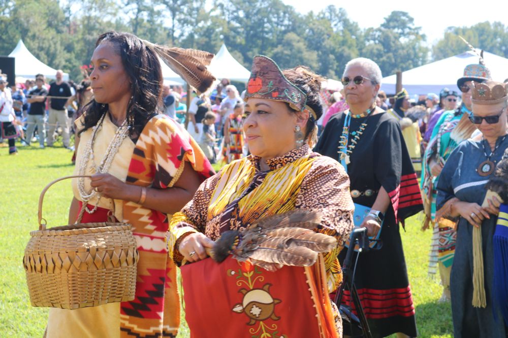 Photo of members of the Nottoway Indian Tribe standing at the Powwow.