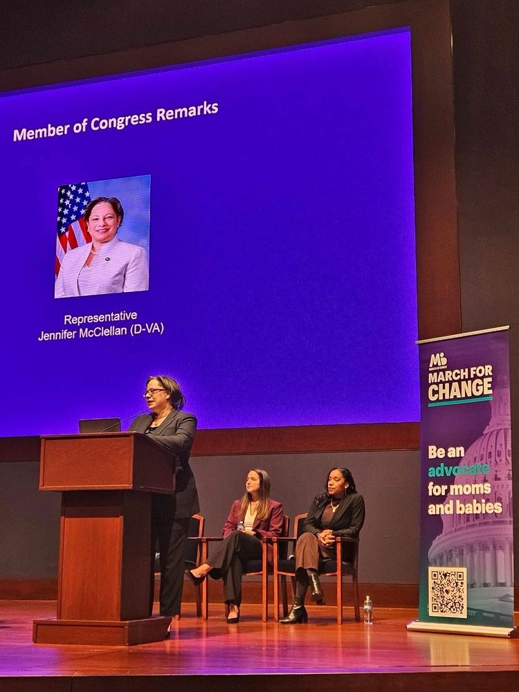Photo of Rep. McClellan speaking at a podium at the March of Dimes briefing.